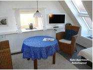 Appartement 6: Wohnzimmer mit Sitzgruppe