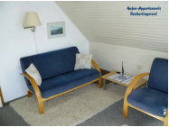 Appartement 6: Wohnzimmer mit Sitzgruppe 