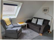 Appartement 2: Wohnzimmer mit Sitzgruppe